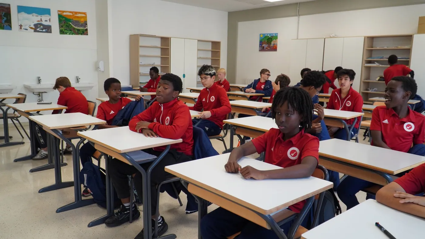 Student-athletes in an academy classroom