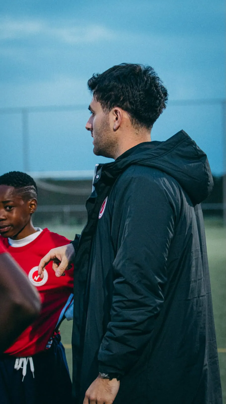 Jaime De Manuel Romero speaking with players during training